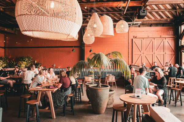 Diners socialise at high tables inside Muy Muy restaurant on Welles Street.