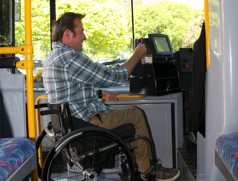 Man in wheelchair boarding Metro bus